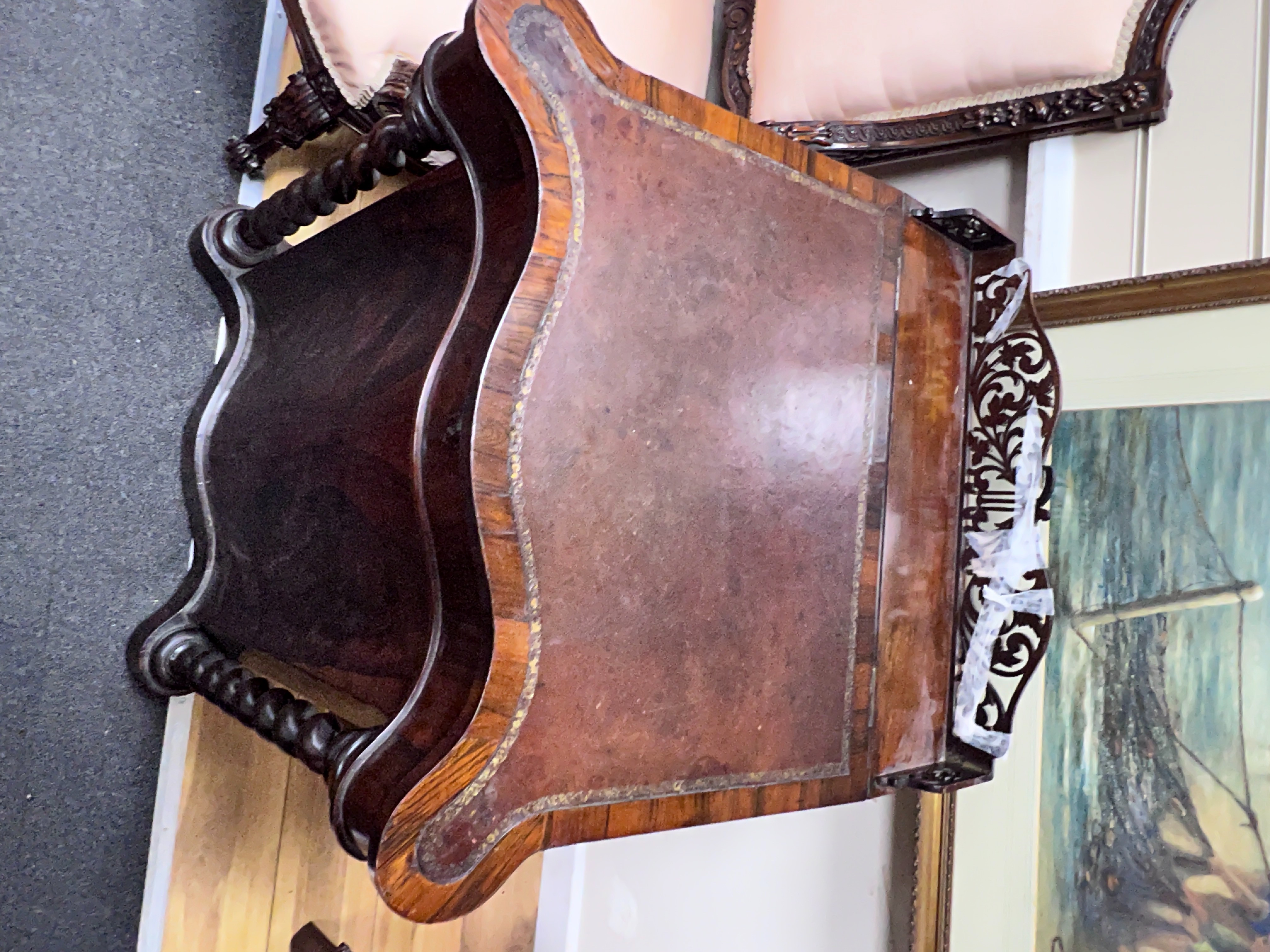 An early Victorian rosewood serpentine fronted Davenport, width 63cm, depth 58cm, height 92cm